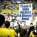 A Michigan fan holds a sign as a tribute to John Wilkins and the Alumni Pep Band before the game against Indiana on Sunday, March 10. Daniel Brenner I AnnArbor.com